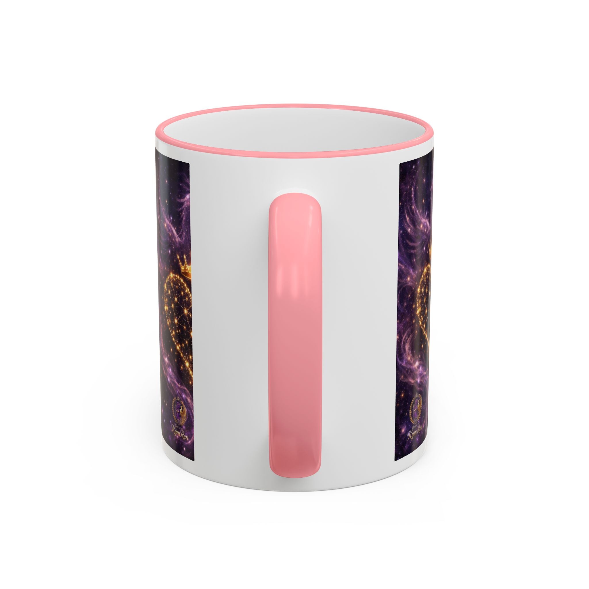 Mug with pink handle and colorful design on a white background