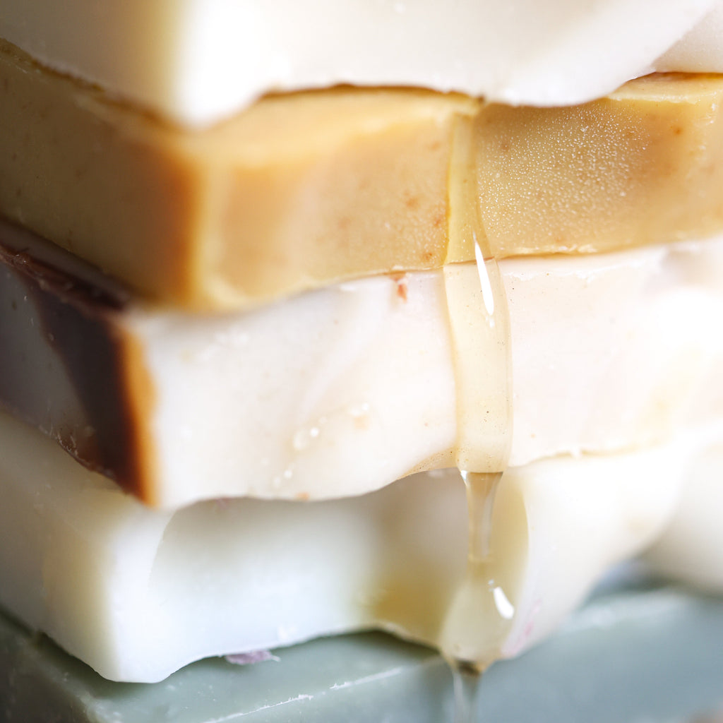 Close-up of layered soap bars with a focus on texture and color gradient.
