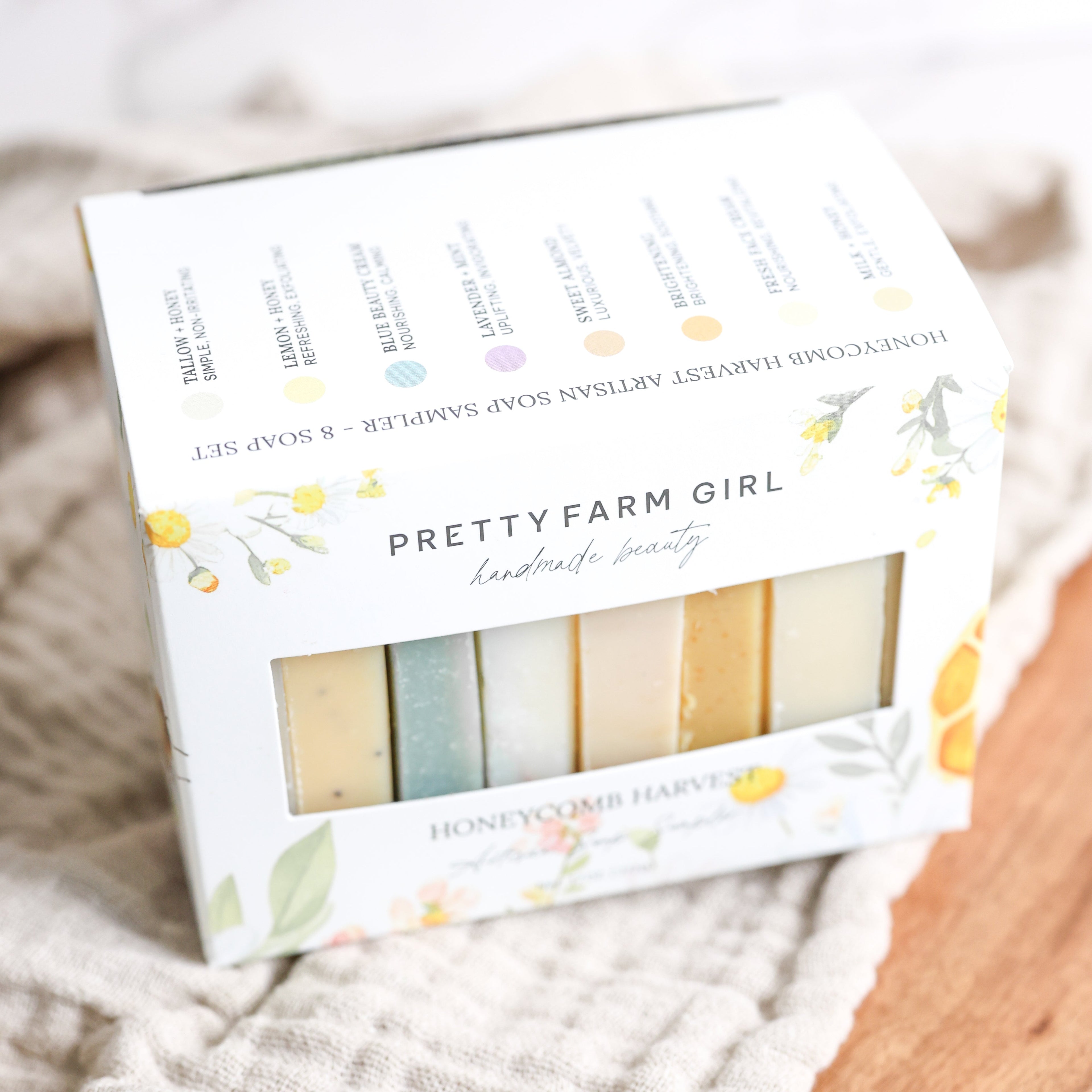 Pretty Farm Girl soap set packaging with soap bars inside on a soft background