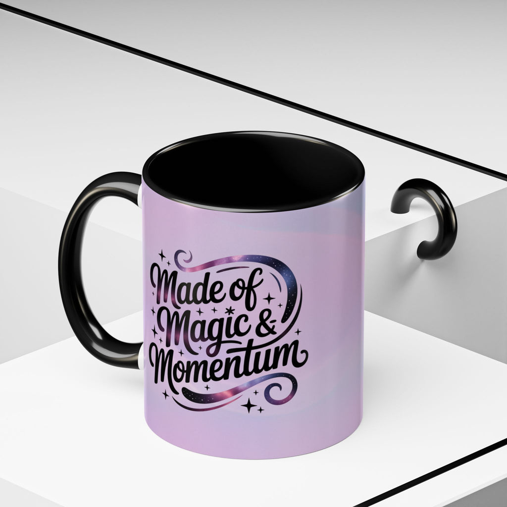 Purple mug with black interior and handle, featuring the text 'Made of Magic & Momentum' on a white background.