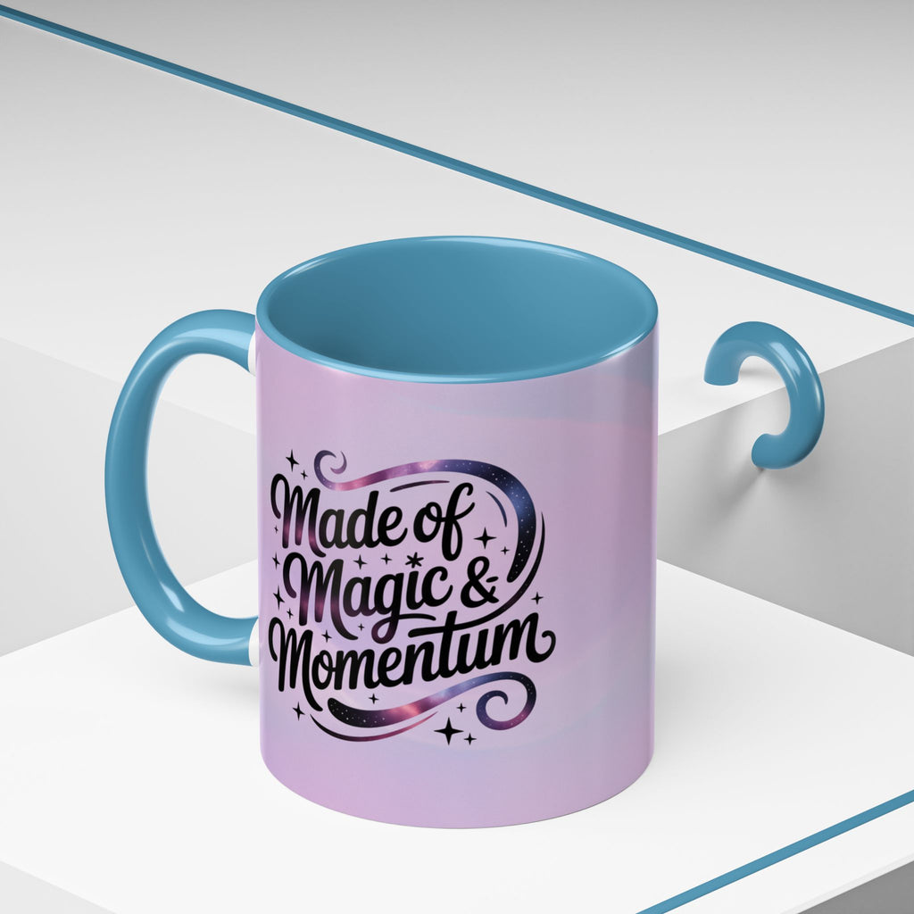 Purple mug with blue interior and handle, featuring the text 'Made of Magic & Momentum' on a white background.