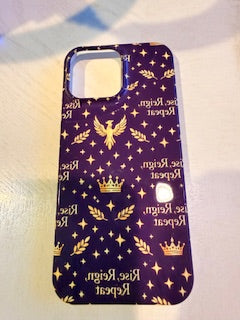 Phone case with gold designs on a marble surface