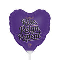 Purple heart-shaped balloon with 'Rise, Reign, Repeat' text on a purple background