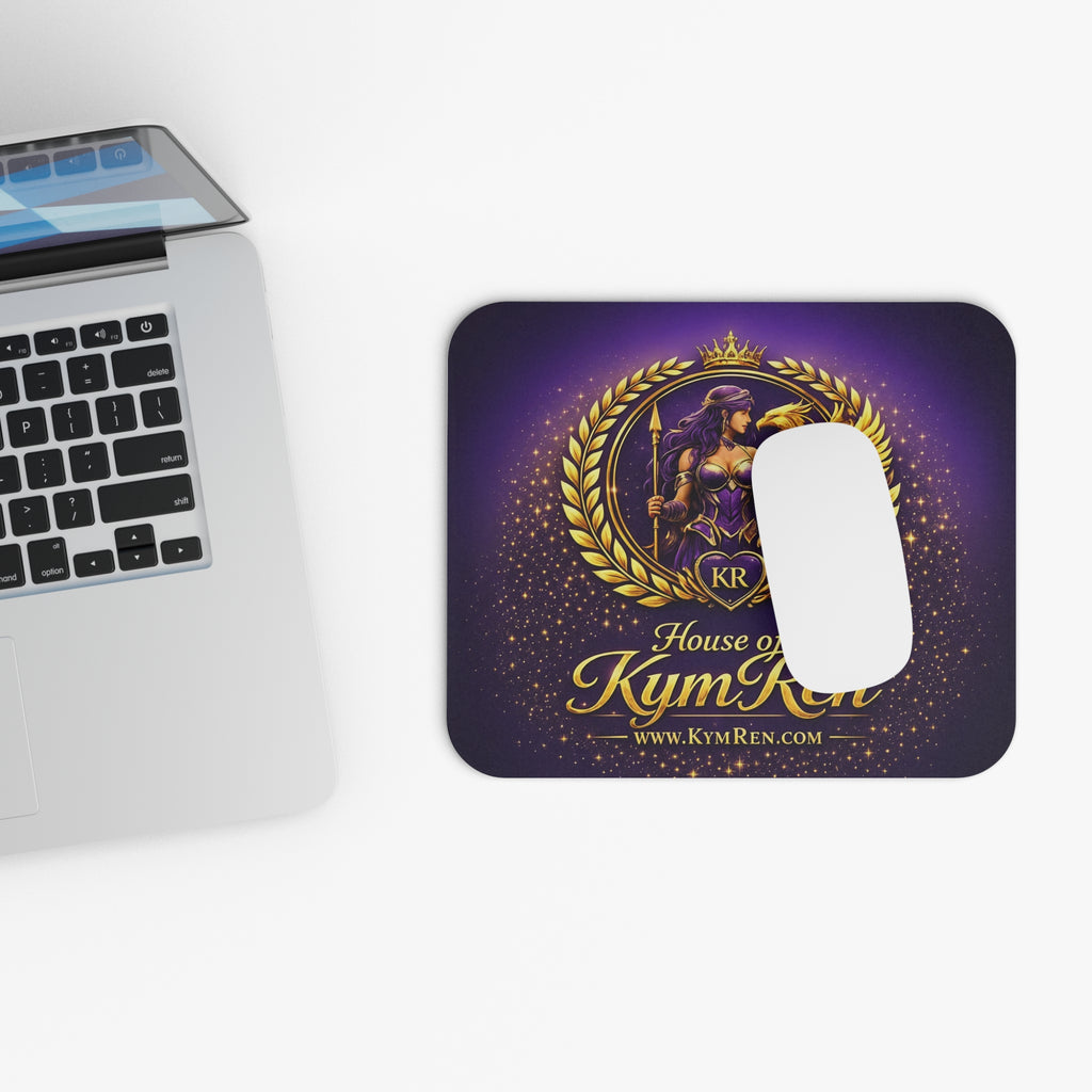 Mouse pad with 'House of Kym Ren' design next to a laptop on a purple surface